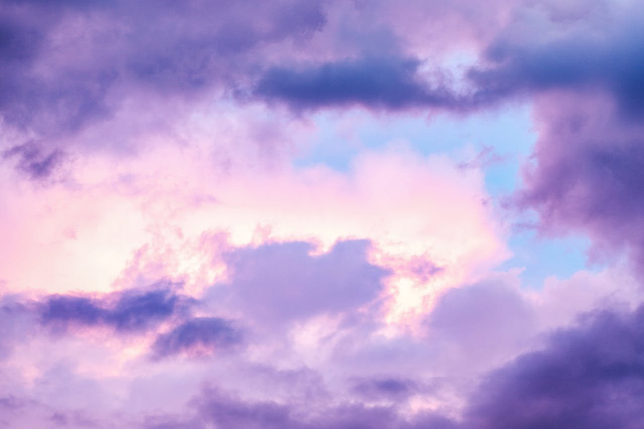A serene sky with pastel-colored clouds creating a peaceful atmosphere.